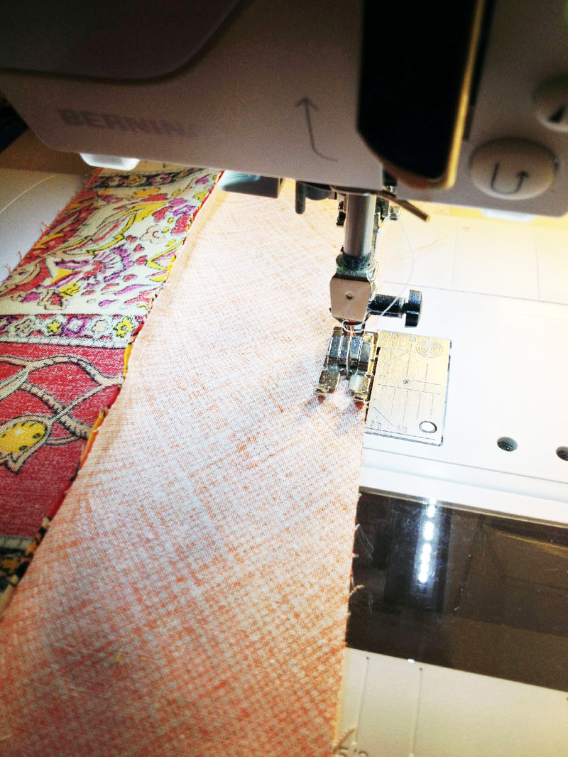 Jelly Roll Race Quilt, sewing strips together lengthwise.