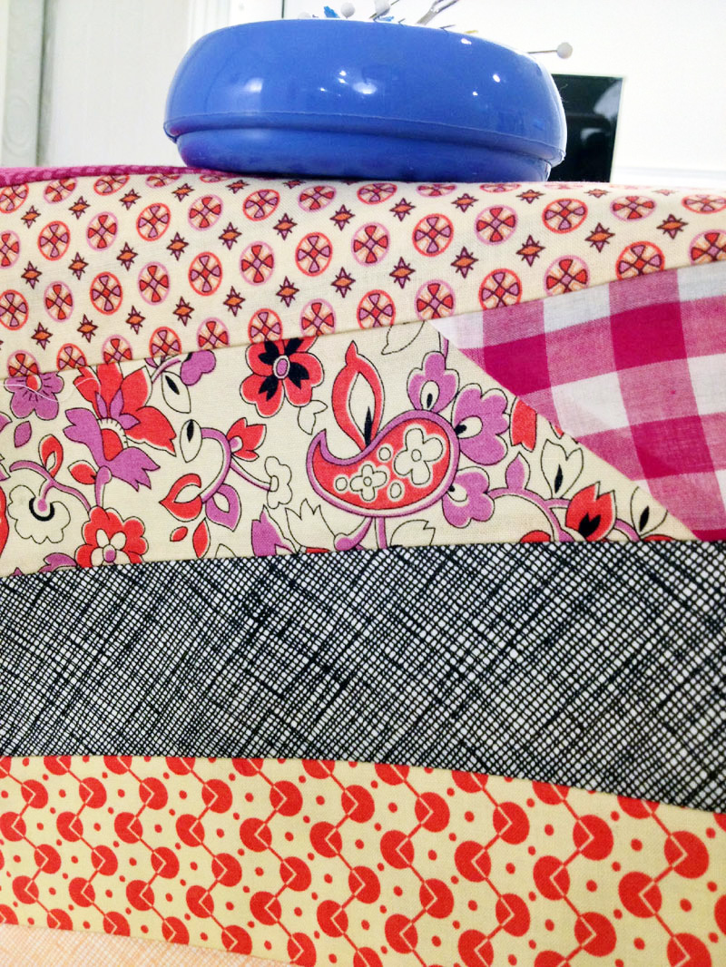 Jelly Roll Race Quilt, several long strips sewn together.