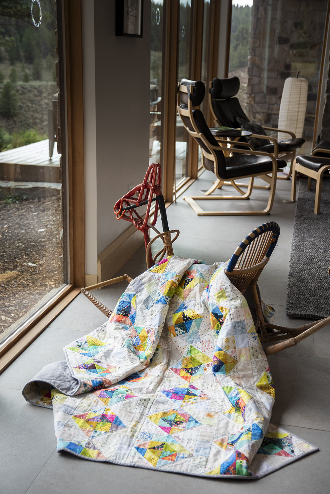 Arda quilt on wicker rocker